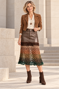 Earth Ombre artistic crochet skirt, front view on a blonde model wearing a cropped caramel jacket.