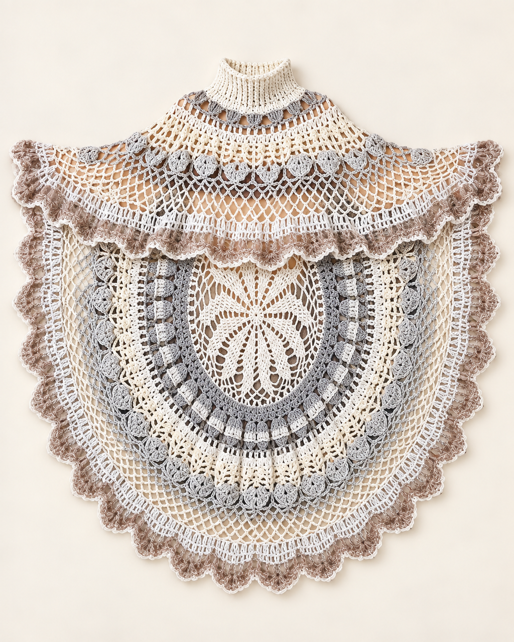 Asymmetric circular ecru and grey handmade crochet poncho laid flat