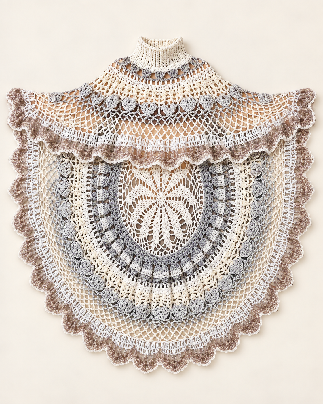 Asymmetric circular ecru and grey handmade crochet poncho laid flat